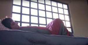 Alex Honnold laying in his sleeping bag